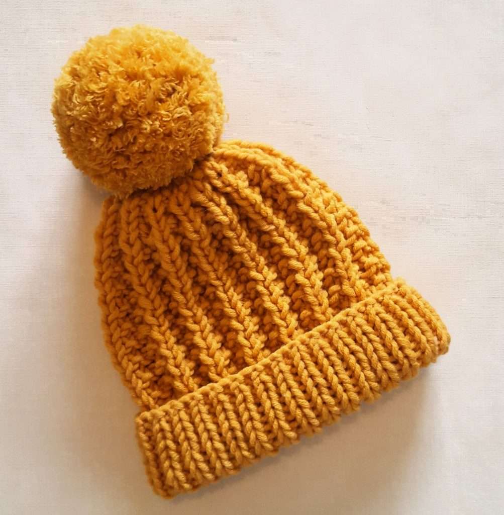 Chunky knit hat in bulky weight yarn with pompom
