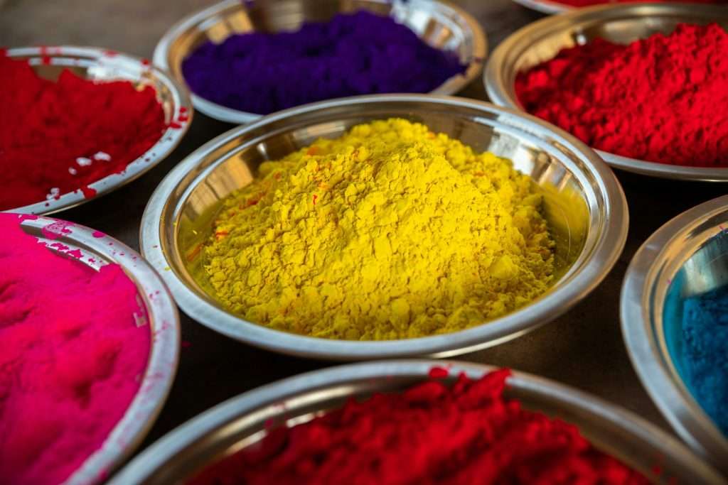 bright powdered dye in stainless steel bowls