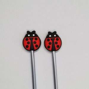 red ladybug point protectors for knitting needles