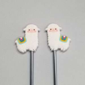 white llama point protectors with colorful saddle