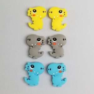 dinosaur silicone stitch stoppers for knitting needles in yellow, blue, and gray