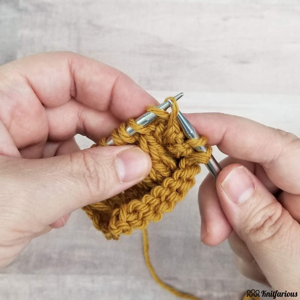 lift the front loop of stitch below onto your left needle and knit it with your right-hand needle