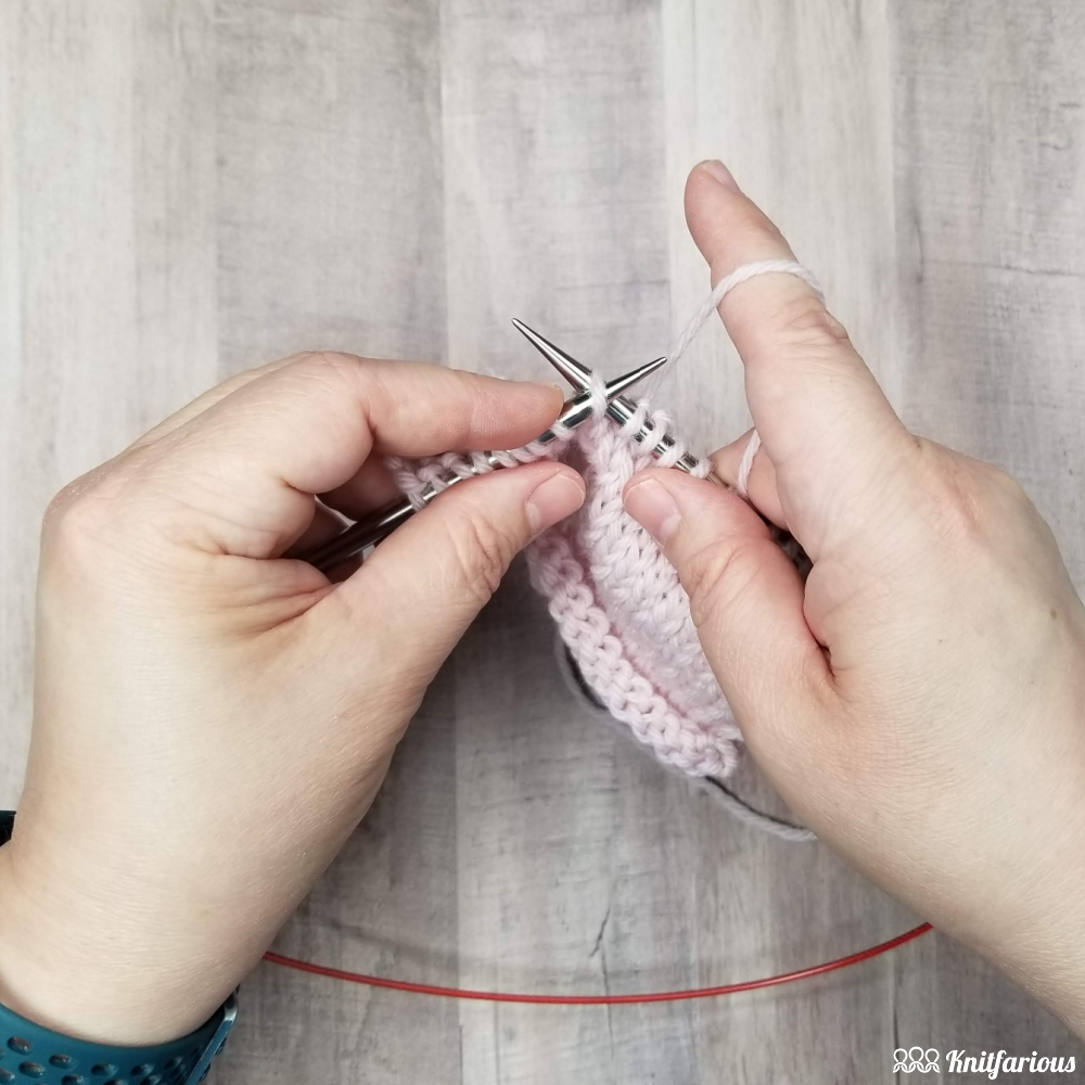 to knit through the back loop, insert your right knitting needle into the back of the stitch