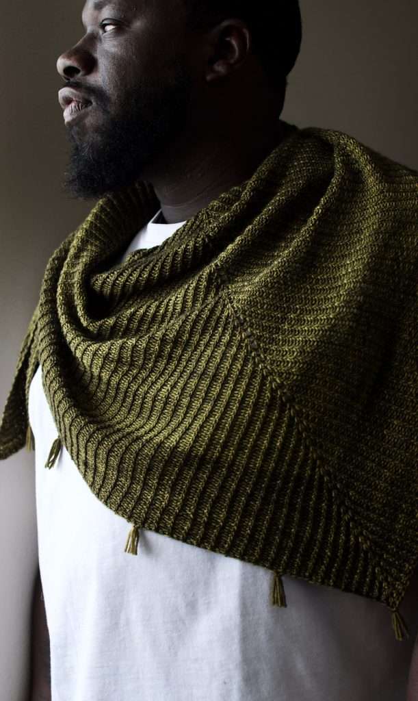 free triangle shawl pattern in solid color of fingering weight yarn features twisted stitches (ktbl)
