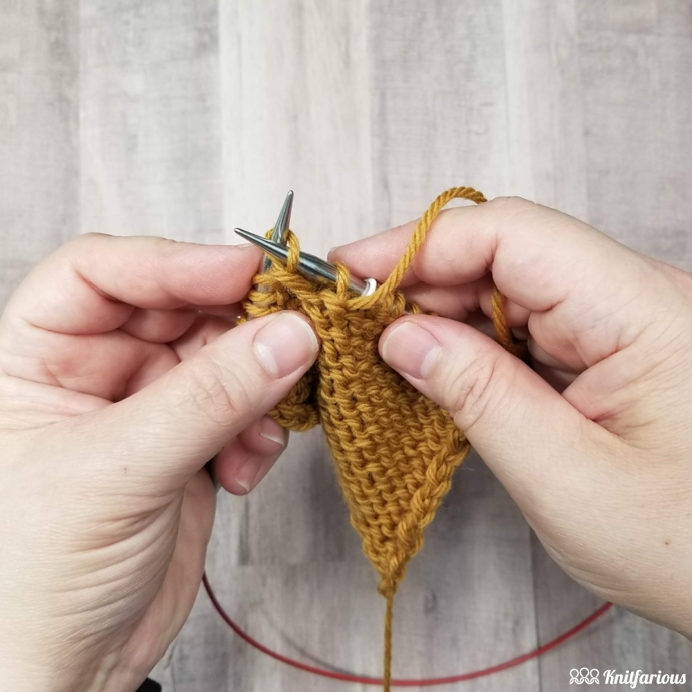 Move yarn forward before you purl through the back loop, then insert your right needle tip through the back loop from back to front