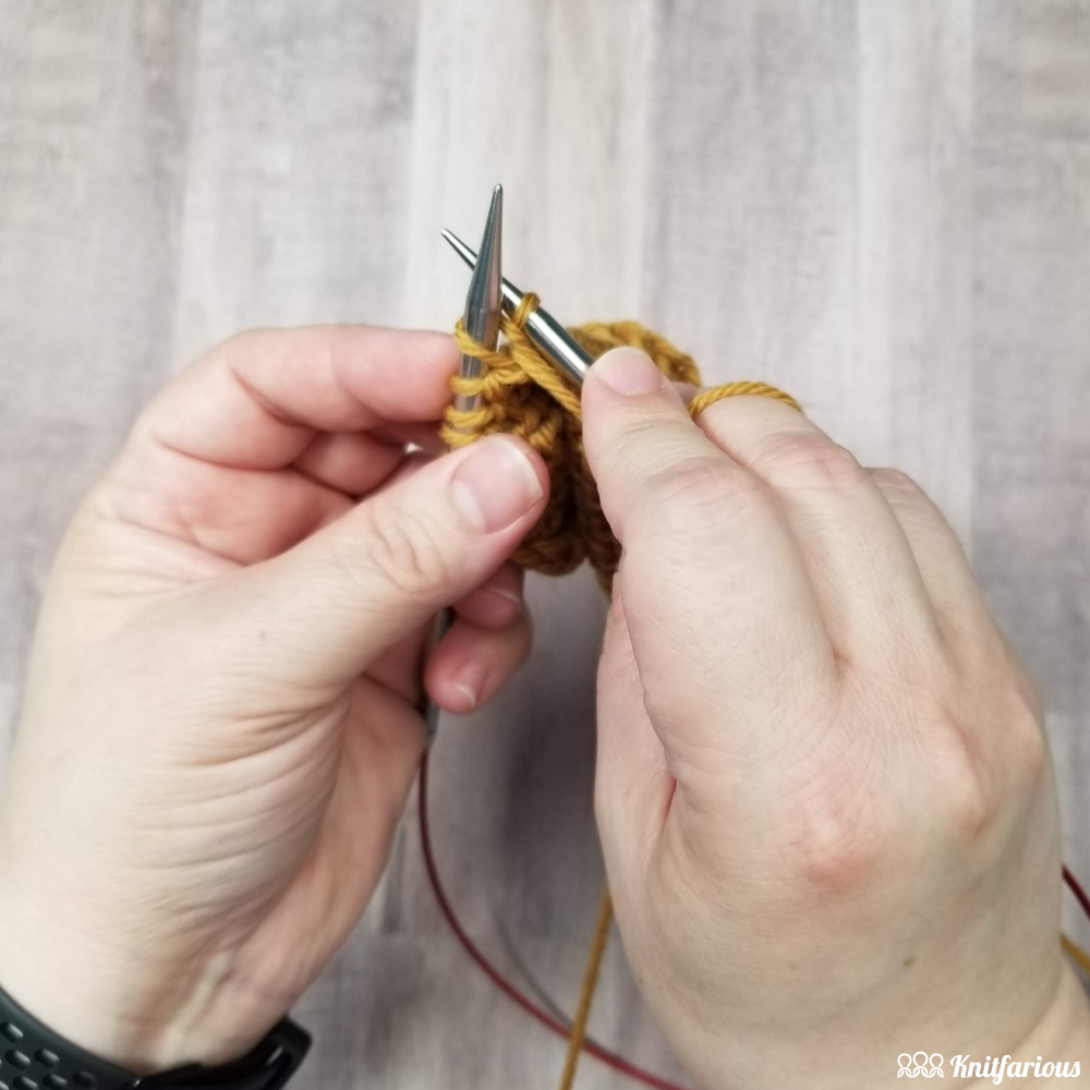 purl the stitch through the back loop and pull the stitch through