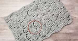 Sahara Tilting Blocks Cowl knit in silver gray yarn and circular knitting needles